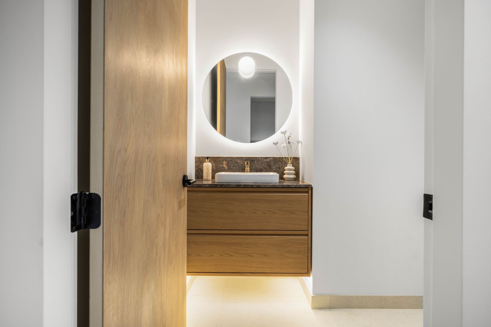 Powder bath with backlit mirror and oak vanity