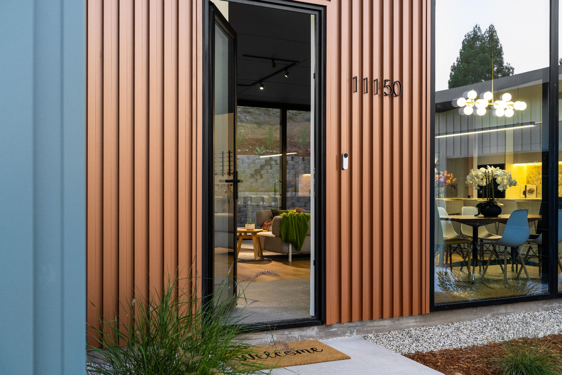 Detail: front entry with copper siding and address