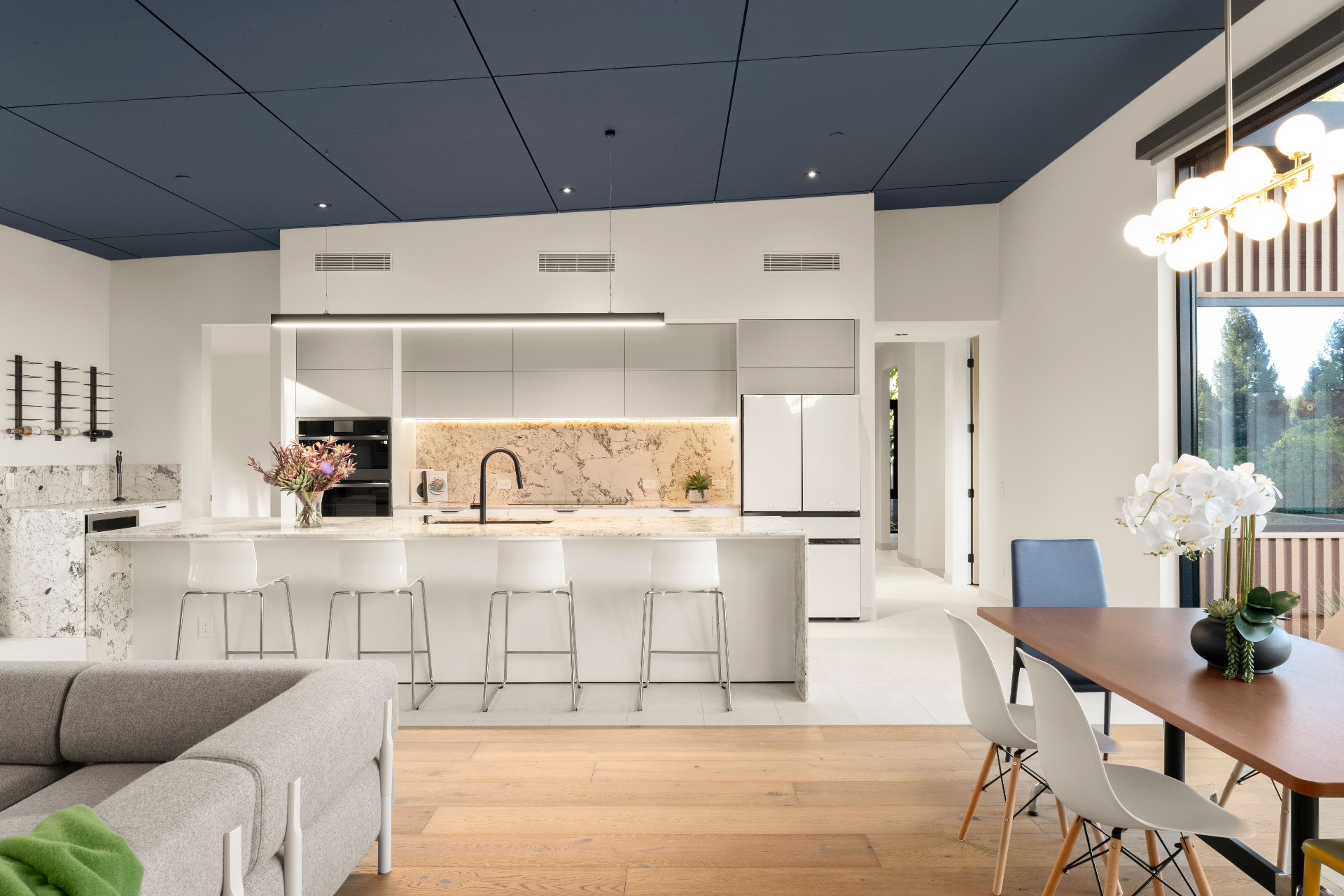 Kitchen with waterfall island and marble backsplash