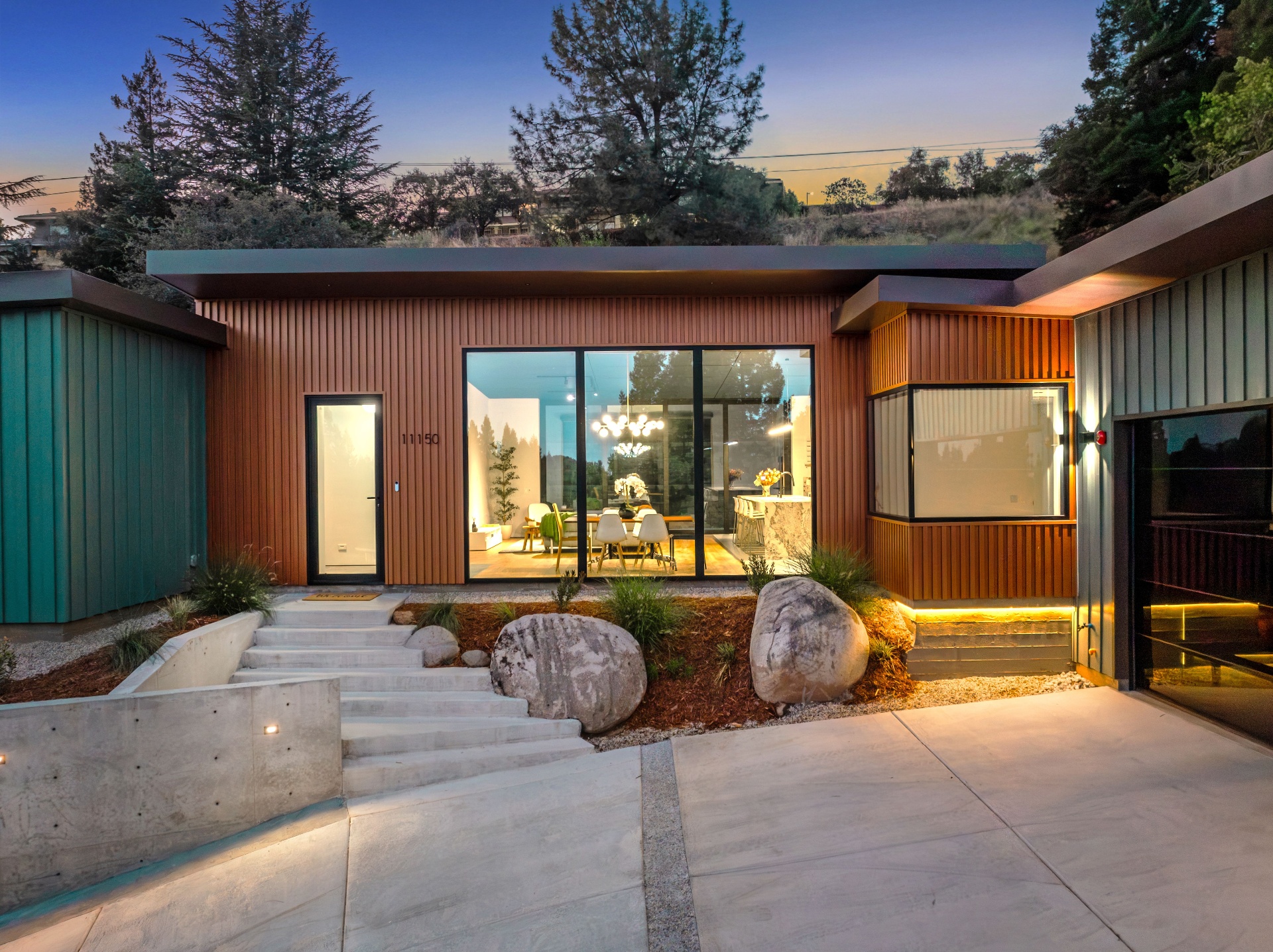 Concrete wall and granite boulders at the entry